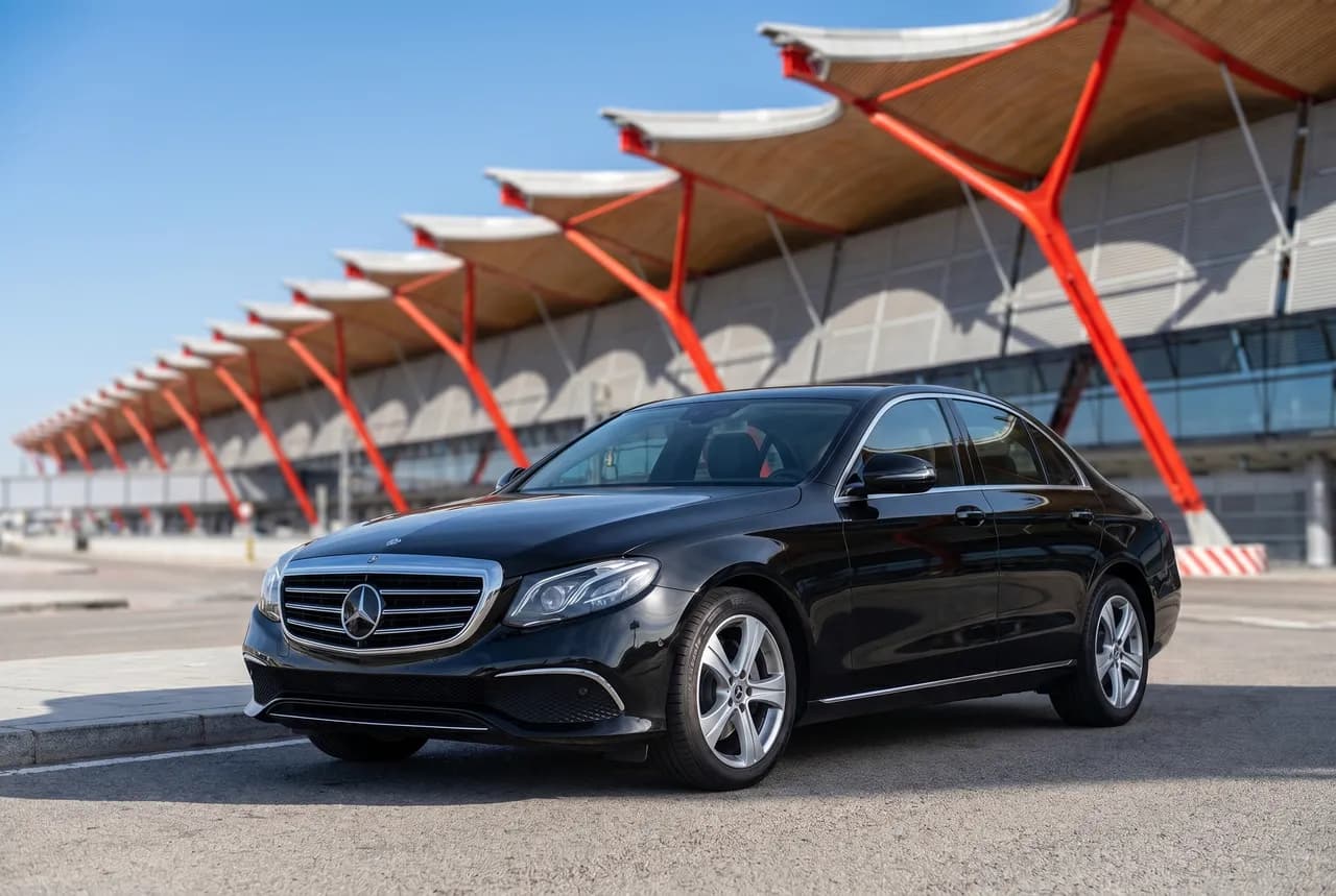 Black E-Class sedan at Madrid-Barajas Terminal 4, private airport transfer for 1 to 3 passengers