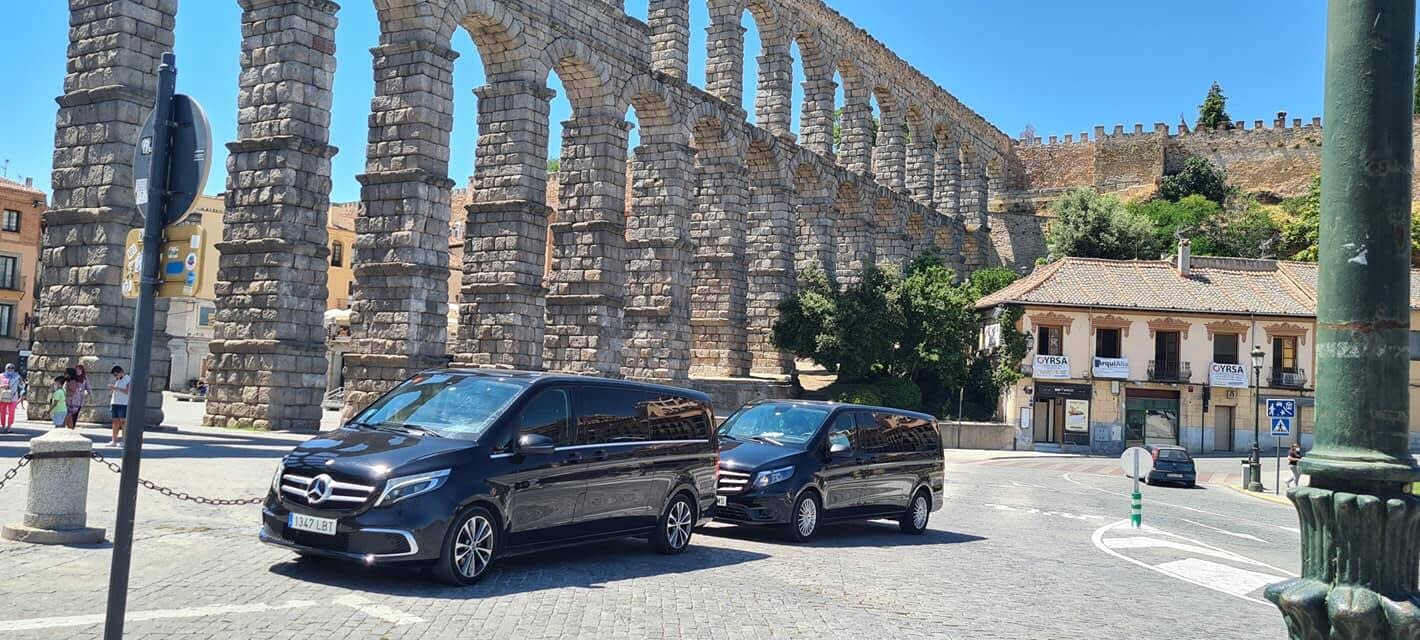 Private driver van parked near a historic Spanish city during a sightseeing day trip from Madrid