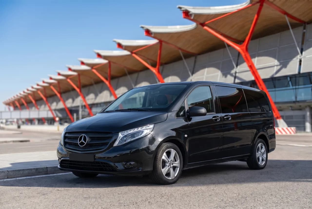 Black 8-seat Vito passenger van at Madrid-Barajas Terminal 4 for group transfers in Madrid